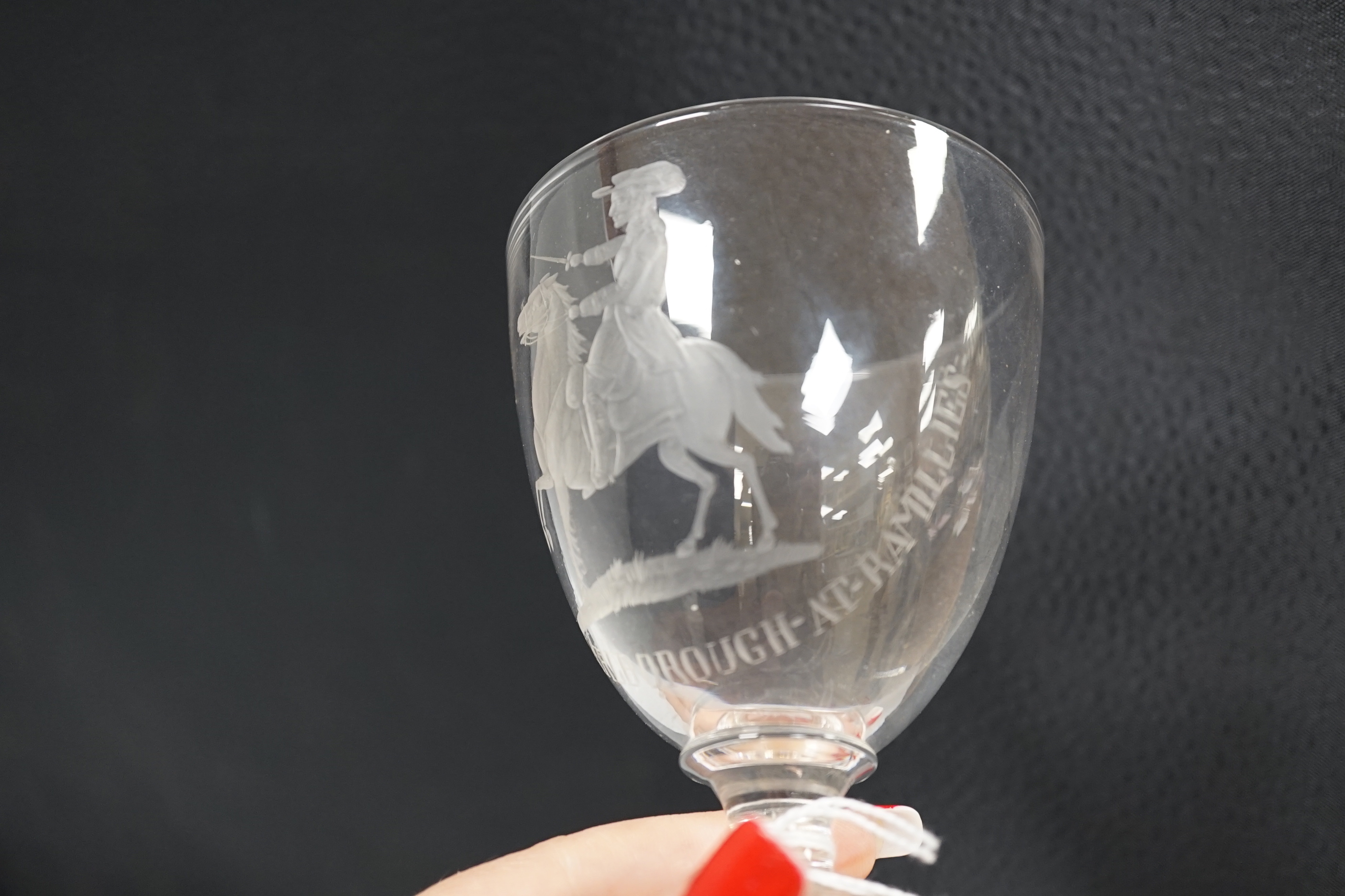 A glass goblet, engraved with the Duke of Marlborough at Ramillies, the goblet is small with a capstan stem and square moulded base with star cut base, likely to be a centenary or bi-centenary goblet of the 1706 battle.